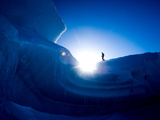 A Hiker Explores an Iceberg Frozen into the Sound Near Axel Heigburg