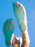 A Girl's Feet Barely Touching the Surface of the Water