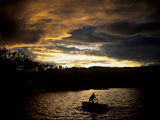 A Man in a Boat on Lake Banyoles
