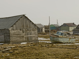 An Old Boat Sits Amongst Sheds and Houses in Snopa Village