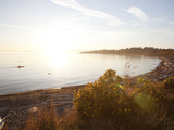 A Kayaker Enjoys a Sunset Paddle