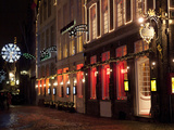 A Street Scene at Night During the Christmas Season