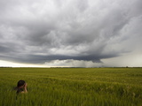 Photographer Taking Photos of Approaching Supercell and Wheat Field
