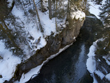 Looking Down into Johnston Canyon and Snowy Forested Landscape