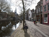 Scenic Street Scene with Bicyclist and Canal