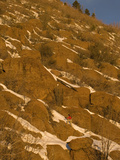 A Woman Hiking in Winter Snow on Mount Elden