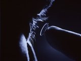 Close Up of Man Inserting a Contact Lens into His Eye