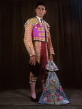 A Matador Poses in Full Regalia with an Embroidered Cape