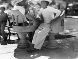Two Men Talk in One of Merida's Plazas