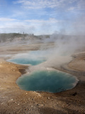 Steam Rising from Turquoise-Hued Water in a Geothermal Colloidal Pool