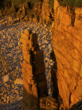 The First Rays of Sunrise on Monument Cove and its Namesake Rock Pillar