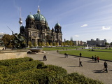 People Strolling the Grounds at the Domplatz Cathedral