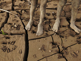 Kara Boys Stand on the Mud-Caked Shoreline of the Omo River