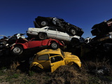 A Pile of Discarded Cars at a Junkyard