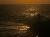 Silhouetted Recreational Fisherman at Twilight