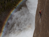A Climber  Without a Rope  Jams Her Hands into Fissures for Ascent