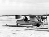A Game Warden's Snowmobile Skims over Thin Ice on Lake Minnetonka