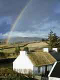 A Rainbow Arches over a Thatched White Cottage and Nearby Fields