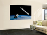 A Command Module Approaches an Awaiting Rocket in Earth Orbit