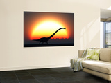 A Silhouetted Omeisaurus Walks Pass the Rising Sun at the Start of a New Day