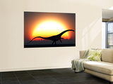 A Silhouetted Diplodocus Dinosaur Takes at the Start of a Prehistoric Day