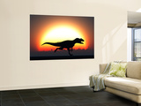 A Silhouetted Allosaurus Sprinting Against a Setting Set at the End of a Jurassic Day