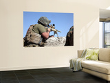 A US Marine Looks Through the Scope of an M40A1 Sniper Rifle
