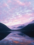 Lake and misty mountains at sunset  Allgau  Germany
