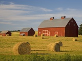 Barns and Hay Bales in Field