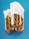 Three hot dogs in buns