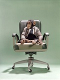 1970s Businessman Chimpanzee Sitting In Office Chair