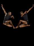 Two male dancers jumping