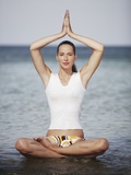 Woman meditating in the ocean