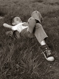 1960s Boy Sleeping In Grass Legs Crossed Holes In Sneakers Baseball Mitt By His Side