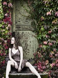 Woman Sitting on Doorstep