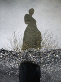 Woman's Ghostly Reflection in Water