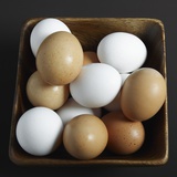 White and Brown Eggs in Basket