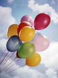 Bunch Of Multicolored Balloons In Blue Sky With White Clouds