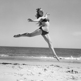 1950S Woman in Bikini Running and Jumping on the Beach Smiling