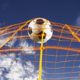 Soccer Ball Going Into Goal Net