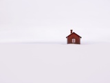 Red Wooden House Surrounded by Snow
