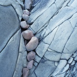 Rocks Against Cracked Boulder