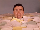 1960s Overwhelmed Screaming Bug-Eyed Man Drowning In Paper Work