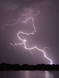 Lightning Striking Ground Near Residential Lake