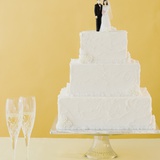 Wedding cake toppers on cake