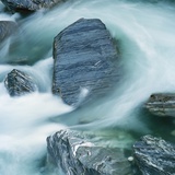 Rushing water and rocks on South Island  New Zealand