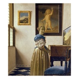 A Young Woman Standing at a Virginal