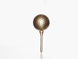 Gold golf ball and tee