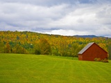 Red Barn in Green Field in Autumn