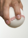 Close up of pitcher holding baseball